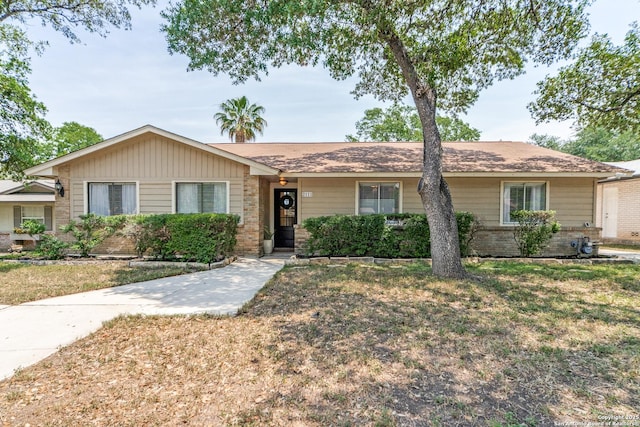2111 Peach Blossom St, San Antonio, TX 78247 - ranch-style home with brick siding and a front yard