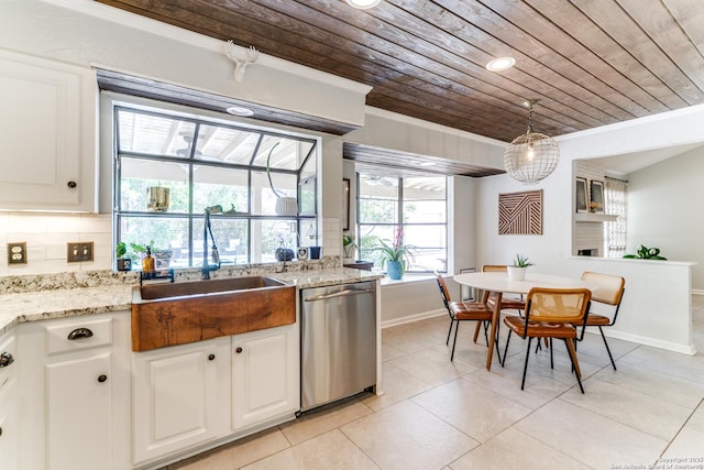 2111 Peach Blossom St, San Antonio, TX 78247 - kitchen with stainless steel dishwasher, wood ceiling, a sink, baseboards, and light tile patterned flooring