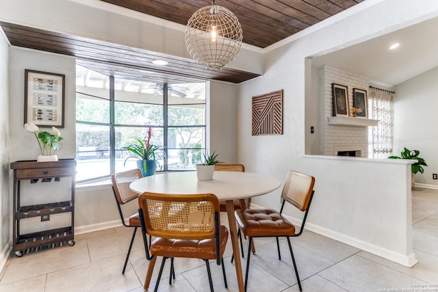 2111 Peach Blossom St, San Antonio, TX 78247 - tiled dining area with wood ceiling, baseboards, a brick fireplace, crown molding, and recessed lighting