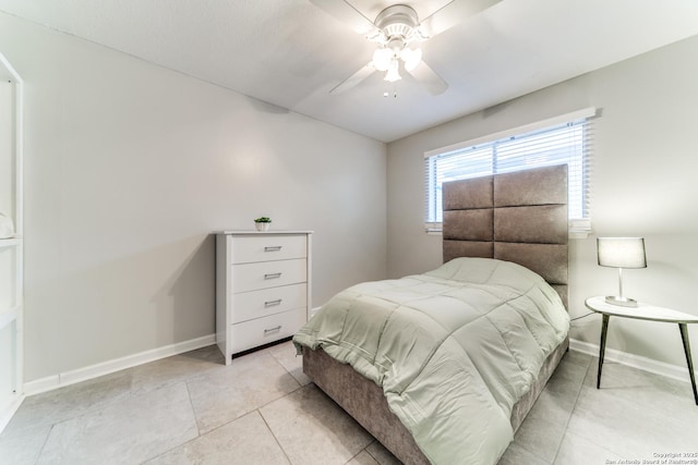 2111 Peach Blossom St, San Antonio, TX 78247 - bedroom featuring baseboards, light tile patterned floors, and a ceiling fan