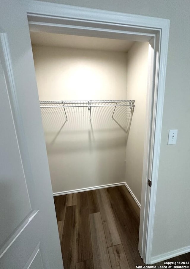 459 Maddux, San Antonio, TX 78227 - walk in closet featuring dark wood-type flooring