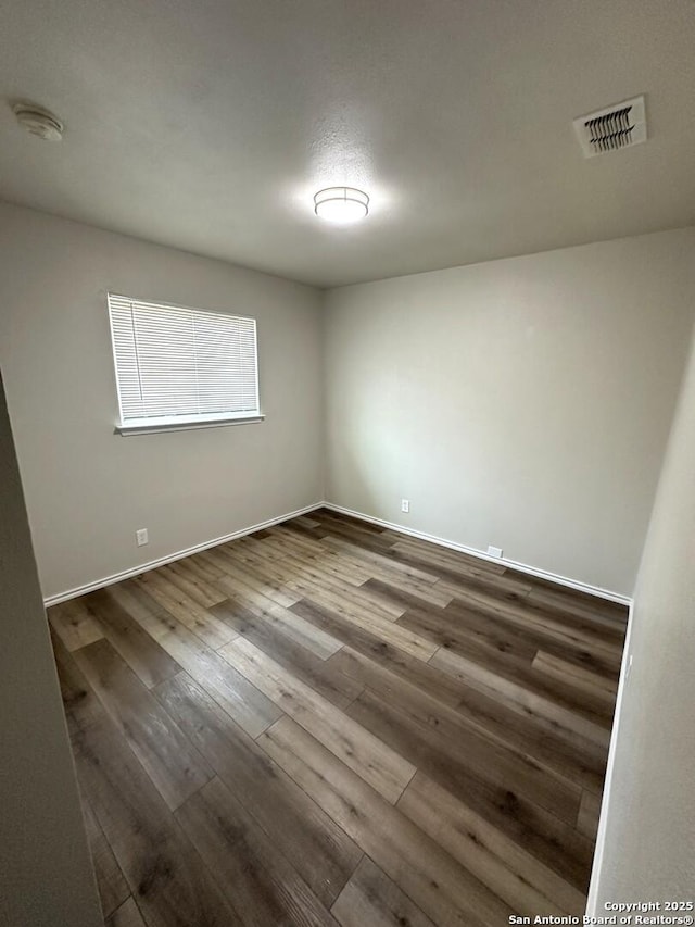 459 Maddux, San Antonio, TX 78227 - empty room featuring dark wood-style flooring and baseboards