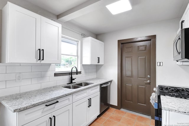 4207 Tallulah, San Antonio, TX 78218 - kitchen featuring stainless steel appliances, a sink, decorative backsplash, white cabinets, and light stone counters