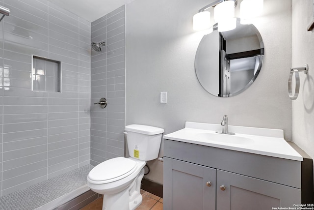 4207 Tallulah, San Antonio, TX 78218 - bathroom featuring vanity, toilet, a tile shower, and tile patterned floors