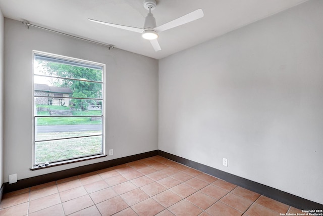 4207 Tallulah, San Antonio, TX 78218 - spare room with a ceiling fan, light tile patterned flooring, and baseboards