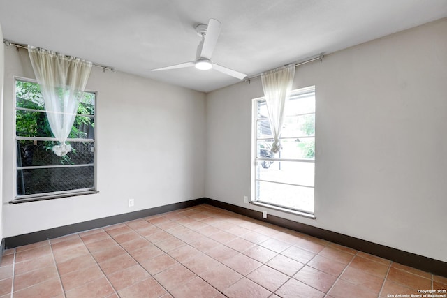 4207 Tallulah, San Antonio, TX 78218 - unfurnished room with ceiling fan, light tile patterned floors, and baseboards