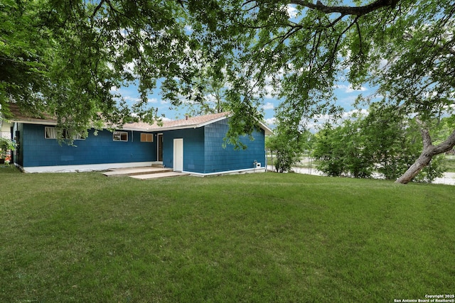 4207 Tallulah, San Antonio, TX 78218 - view of grassy yard featuring a patio