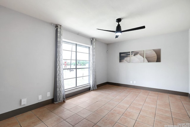 4207 Tallulah, San Antonio, TX 78218 - empty room featuring a ceiling fan, light tile patterned floors, and baseboards