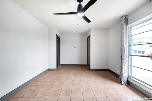 4207 Tallulah, San Antonio, TX 78218 - spare room with ceiling fan, light tile patterned floors, and baseboards