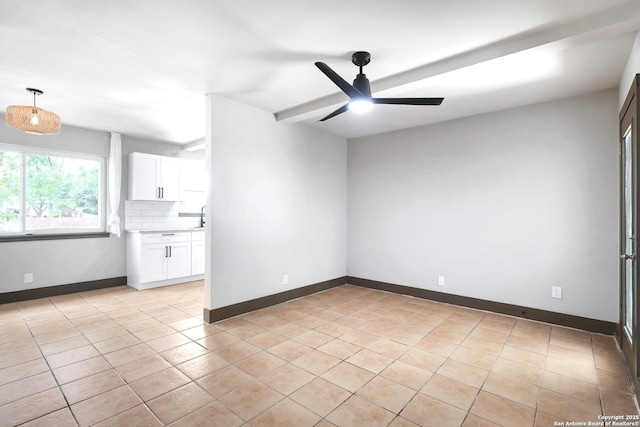 4207 Tallulah, San Antonio, TX 78218 - spare room with a ceiling fan, light tile patterned floors, a sink, and baseboards
