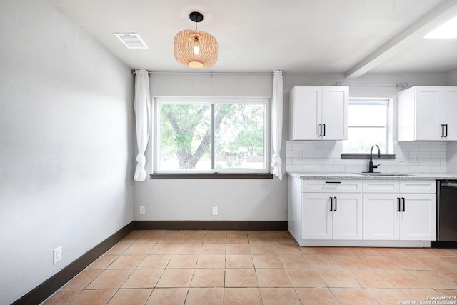 4207 Tallulah, San Antonio, TX 78218 - kitchen with a sink, decorative backsplash, white cabinetry, stainless steel dishwasher, and beam ceiling