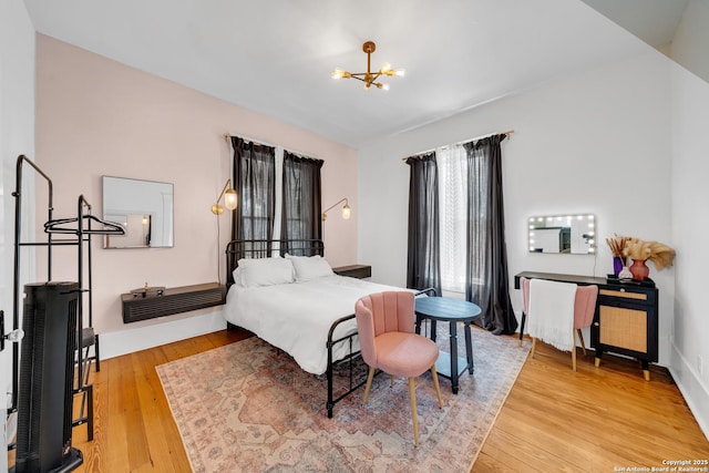 419 Wickes, San Antonio, TX 78210 - bedroom with a chandelier and light wood finished floors