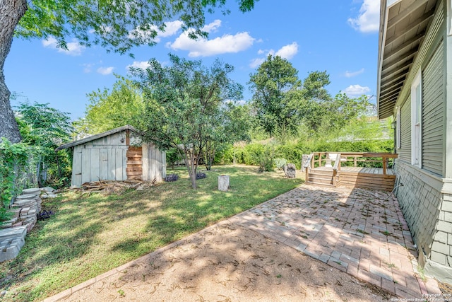 419 Wickes, San Antonio, TX 78210 - view of green lawn featuring a patio area, an outbuilding, and a shed