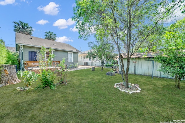 419 Wickes, San Antonio, TX 78210 - view of yard with a wooden deck and an outdoor structure