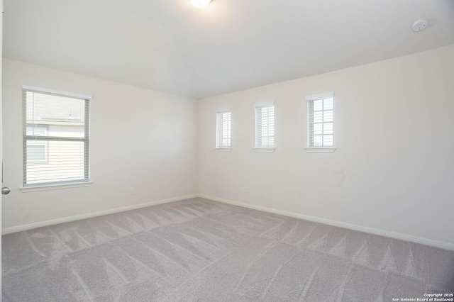 9569 Witten Dr, San Antonio, TX 78254 - empty room featuring baseboards, light colored carpet, and a smoke detector
