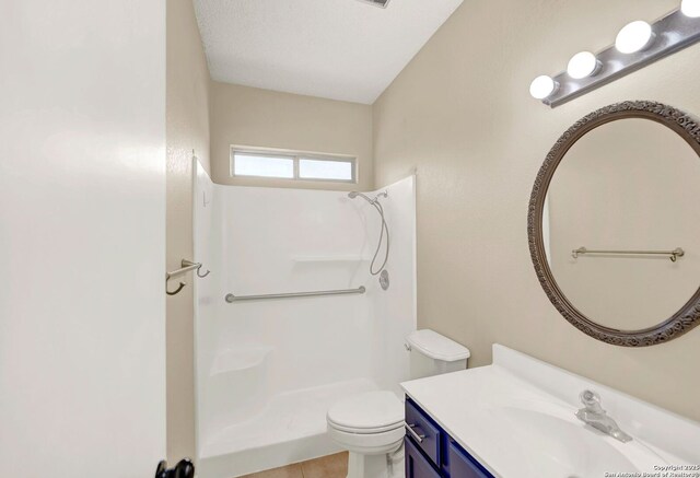 1314 Acorn, Hondo, TX 78861 - bathroom with a shower, toilet, vanity, and tile patterned flooring
