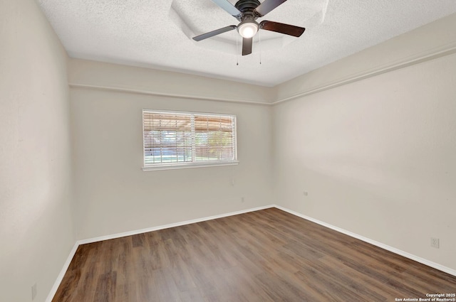 1314 Acorn, Hondo, TX 78861 - unfurnished room with wood finished floors, a ceiling fan, baseboards, and a textured ceiling