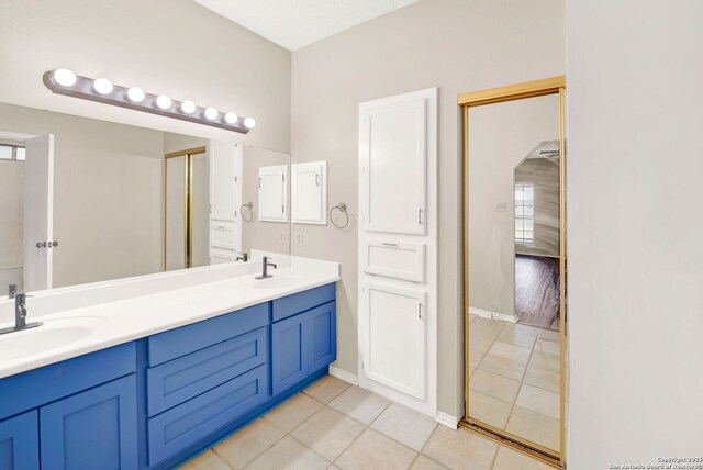 1314 Acorn, Hondo, TX 78861 - bathroom with tile patterned floors, double vanity, and baseboards
