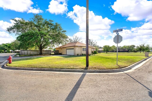 1314 Acorn, Hondo, TX 78861 - view of front facade with driveway and an attached garage