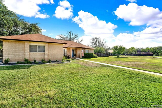 1314 Acorn, Hondo, TX 78861 - single story home featuring a front yard and brick siding