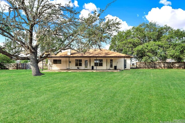 1314 Acorn, Hondo, TX 78861 - back of property with a patio and board and batten siding
