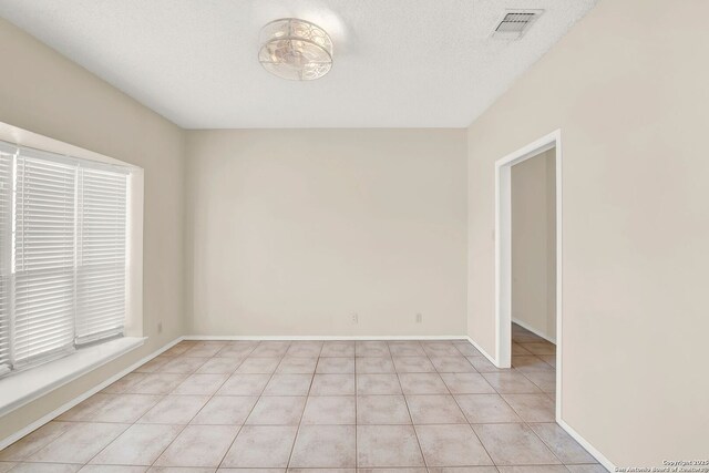 1314 Acorn, Hondo, TX 78861 - empty room featuring light tile patterned floors and baseboards