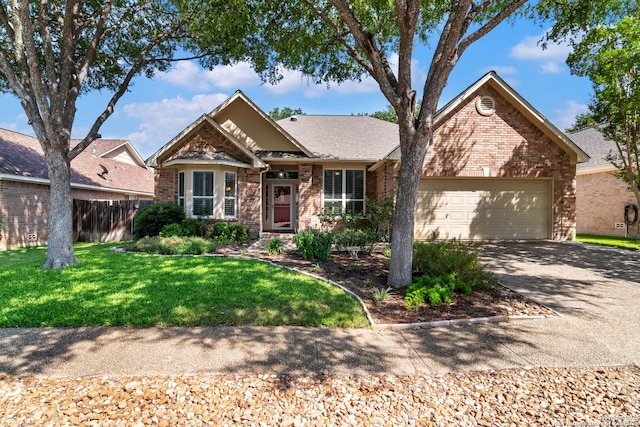 2426 Enfield Grove, San Antonio, TX 78231 - view of front of home with brick siding, an attached garage, driveway, and roof with shingles