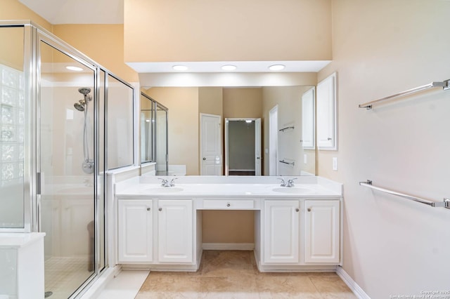 2426 Enfield Grove, San Antonio, TX 78231 - full bath with a stall shower, double vanity, and tile patterned floors