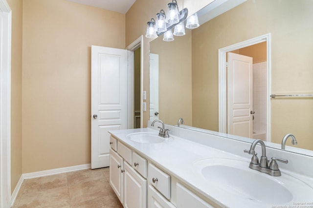 2426 Enfield Grove, San Antonio, TX 78231 - bathroom featuring double vanity, baseboards, and tile patterned floors