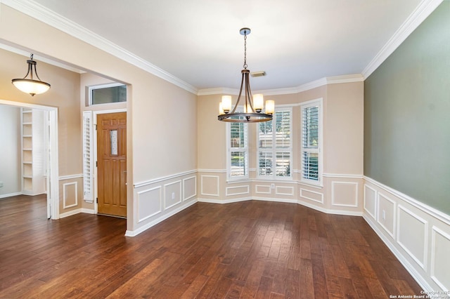 2426 Enfield Grove, San Antonio, TX 78231 - unfurnished dining area featuring a chandelier, dark wood-style floors, ornamental molding, a decorative wall, and wainscoting