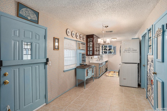 5954 Oak Run, San Antonio, TX 78247 - kitchen featuring a sink, a textured ceiling, wallpapered walls, light tile patterned floors, and decorative light fixtures
