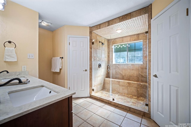 103 River Mdw, Castroville, TX 78009 - full bathroom featuring a stall shower, tile patterned floors, and double vanity