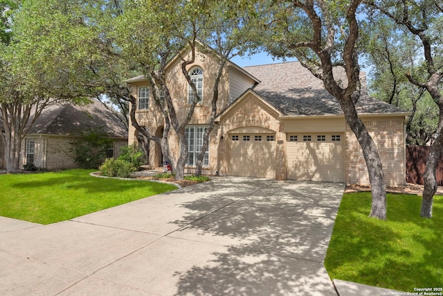 18852 Agin Ct, San Antonio, TX 78258 - traditional-style house with brick siding, driveway, an attached garage, and a front lawn