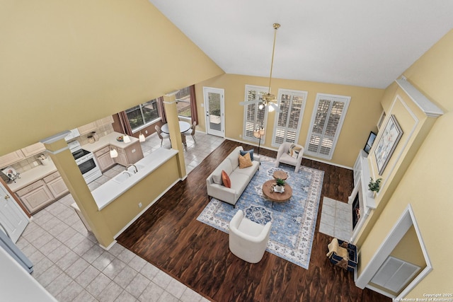 18852 Agin Ct, San Antonio, TX 78258 - living room featuring healthy amount of natural light, baseboards, ceiling fan, lofted ceiling, and wood finished floors