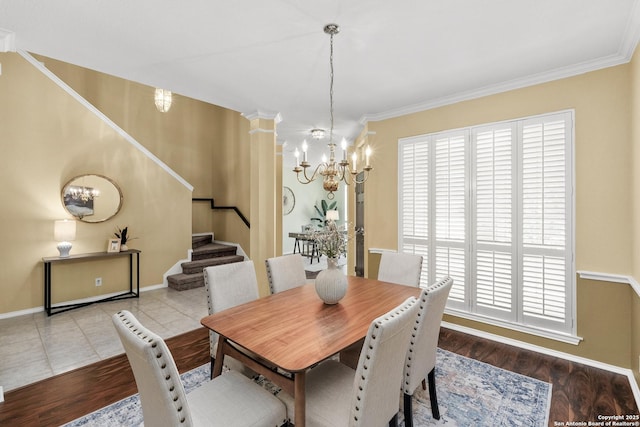 18852 Agin Ct, San Antonio, TX 78258 - dining room featuring a chandelier, stairs, wood finished floors, baseboards, and ornamental molding