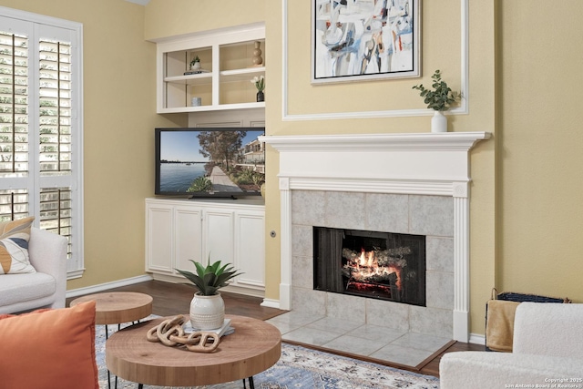 18852 Agin Ct, San Antonio, TX 78258 - living room with a tile fireplace, wood finished floors, and baseboards