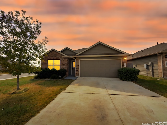 2494 Mccrae, New Braunfels, TX 78130 - view of front of home featuring a garage, concrete driveway, a front lawn, and brick siding