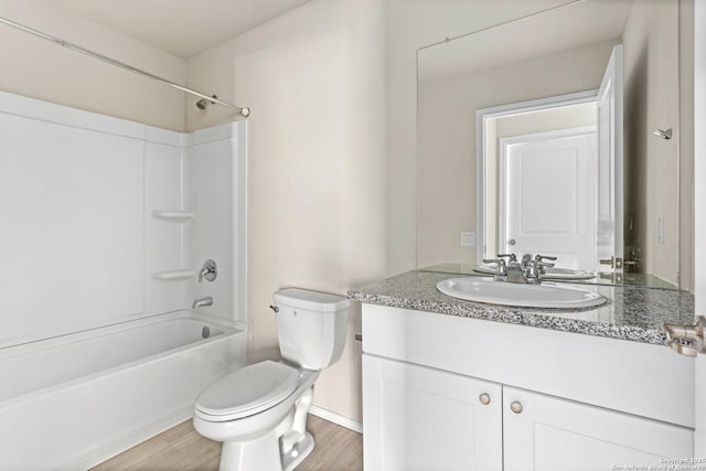 11947 Sand Wedge, San Antonio, TX 78221 - bathroom with toilet, wood finished floors, vanity, shower / washtub combination, and baseboards
