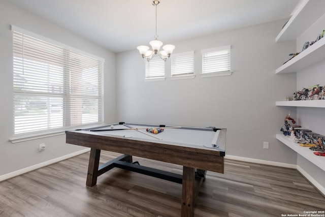 11510 Bakersfield Pass, San Antonio, TX 78245 - recreation room featuring a chandelier, baseboards, and wood finished floors
