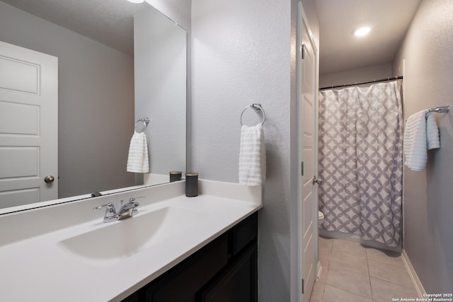 11510 Bakersfield Pass, San Antonio, TX 78245 - full bath with tile patterned floors, vanity, curtained shower, and toilet