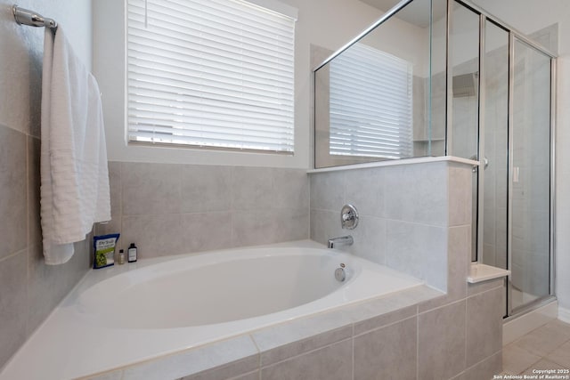 11510 Bakersfield Pass, San Antonio, TX 78245 - bathroom featuring a shower stall, plenty of natural light, and a bath