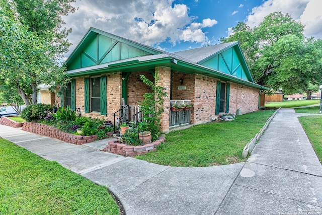 5003 Rustic Rdg, San Antonio, TX 78228 - view of front facade with brick siding, a front yard, and covered porch