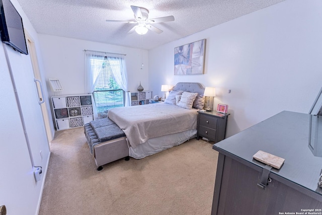 5003 Rustic Rdg, San Antonio, TX 78228 - bedroom with a textured ceiling, light carpet, and a ceiling fan