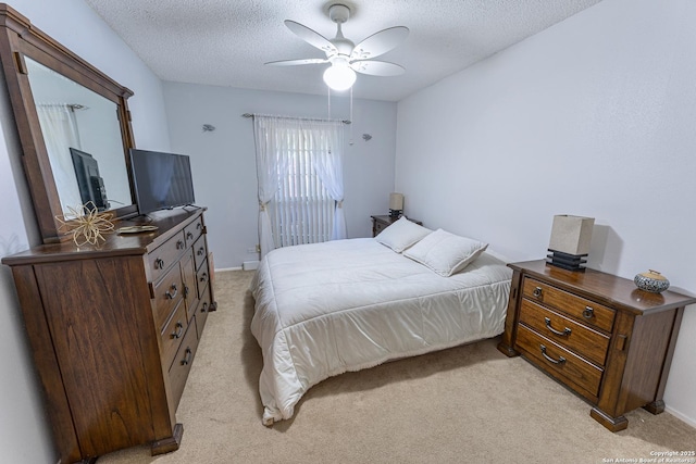 5003 Rustic Rdg, San Antonio, TX 78228 - bedroom with light colored carpet, a textured ceiling, baseboards, and ceiling fan