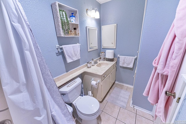 5003 Rustic Rdg, San Antonio, TX 78228 - full bathroom with tile patterned flooring, a textured wall, vanity, toilet, and baseboards