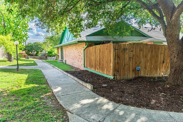 5003 Rustic Rdg, San Antonio, TX 78228 - view of property exterior featuring brick siding and roof with shingles
