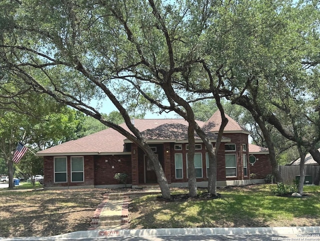 2411 Kelso, San Antonio, TX 78248 - view of front of home with a shingled roof and brick siding