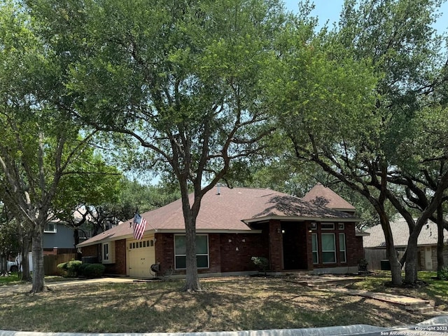 2411 Kelso, San Antonio, TX 78248 - view of front of home featuring a garage, brick siding, fence, and roof with shingles