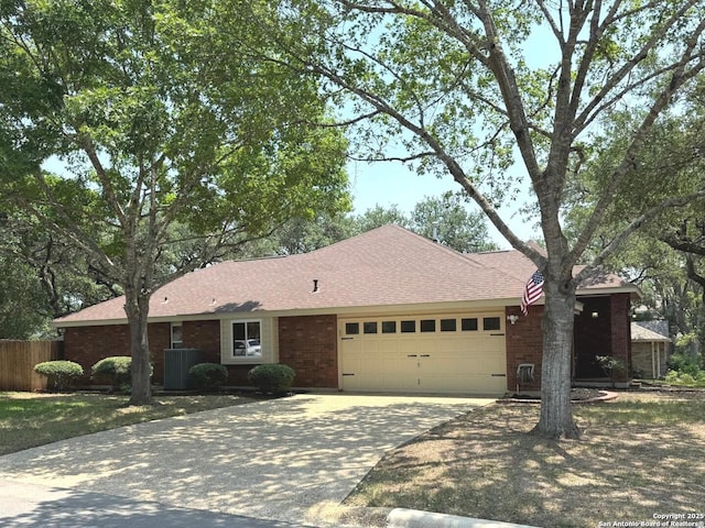 2411 Kelso, San Antonio, TX 78248 - single story home featuring a garage, driveway, cooling unit, and brick siding