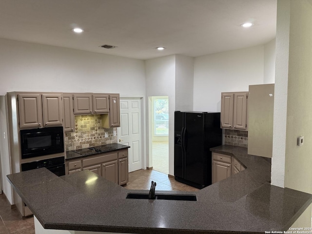 2411 Kelso, San Antonio, TX 78248 - kitchen featuring a sink, black appliances, dark countertops, backsplash, and recessed lighting